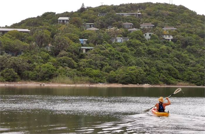 A canoe on the still water of the Chintsa lagoon