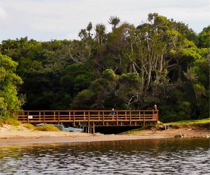 The wooden footbridge crossing the Chintsa lagoon to the beach