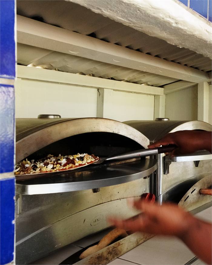A pizza fresh from the oven at the pool bar
